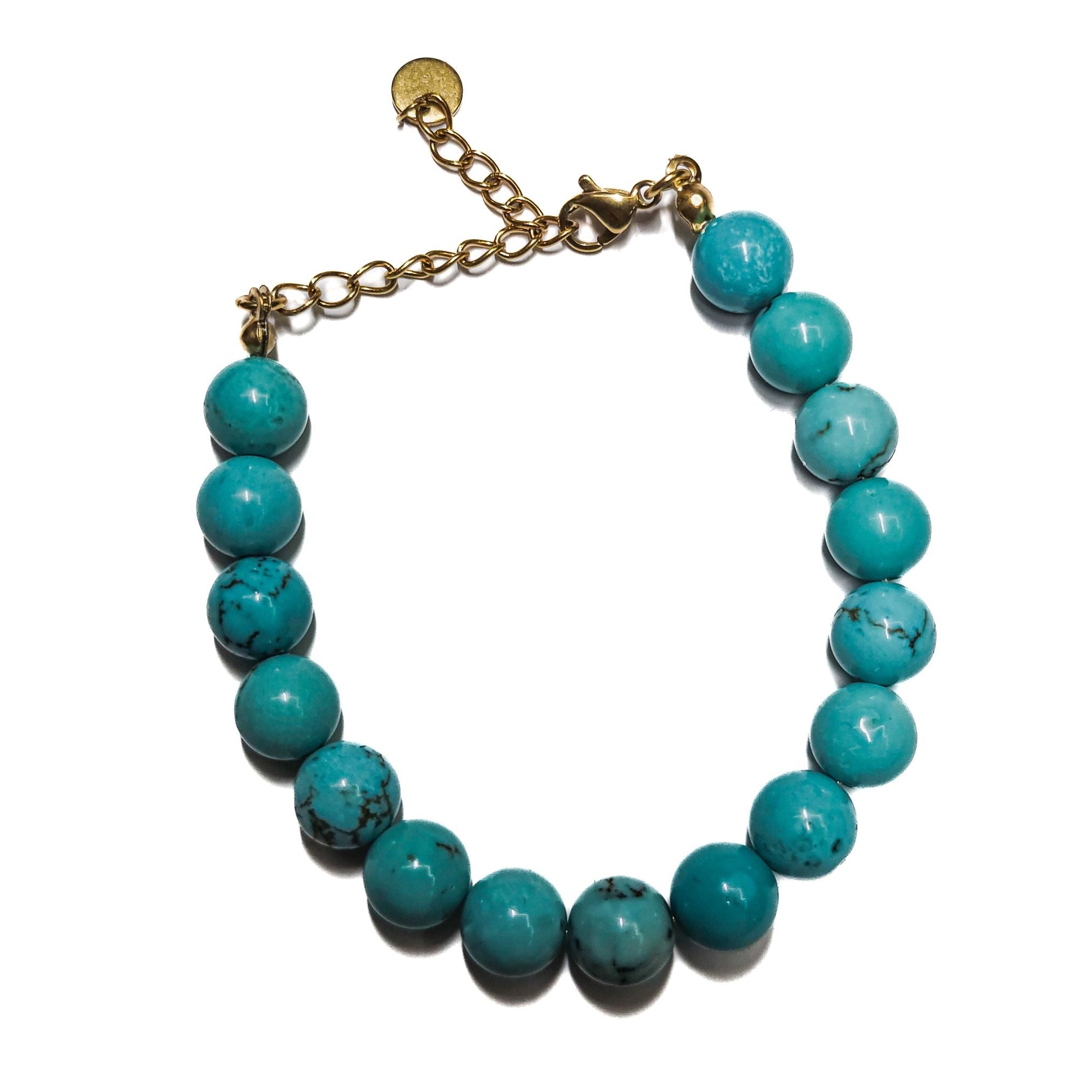 Bracelet turquoise femme en pierre gemme magnésite avec finition dorée .