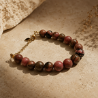 Bracelet en perles de rhodonite roses et noires avec chaîne dorée réglable